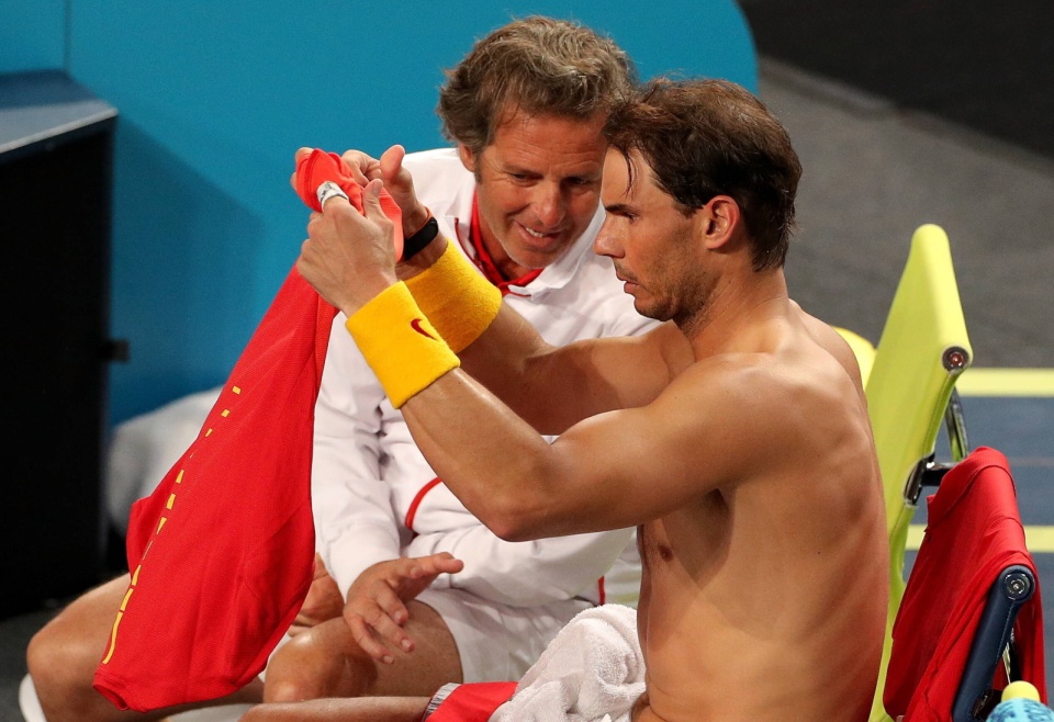 Francisco Roig (w tle) nowym trenerem Igi Świątek/fot. PAP/Richard Wainwright